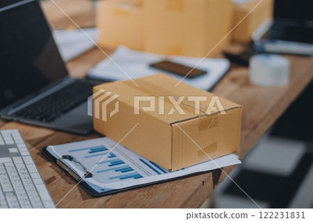 Portrait of Starting small businesses SME owners female entrepreneurs working on receipt box and check online orders to prepare to pack the boxes, sell to customers, SME business ideas online. 122231831