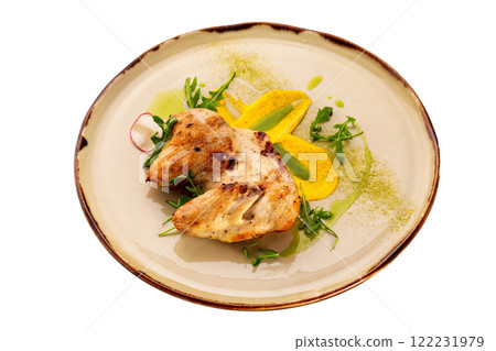 Grilled chicken breast served with sauce on a plate isolated at white background. Grilled chicken breast served with sauce on a plate isolated at white background. 122231979