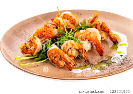Plate of grilled shrimps served with sauce isolated at white background. Plate of grilled shrimps served with sauce isolated at white background. 122231993