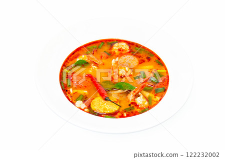 Closeup plate of traditional thai soup - tom yum kung isolated at white background. Closeup plate of traditional thai soup - tom yum kung isolated at white background. 122232002