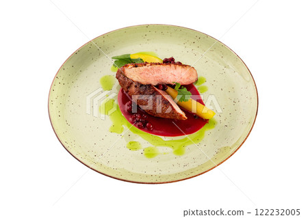 Filet mignon steak served with sauce on a plate isolated at white background. 122232005