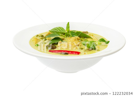 Closeup plate of thraditional thailand meal - green curry with chicken and eggplants served in a plate isolated at white background. 122232034