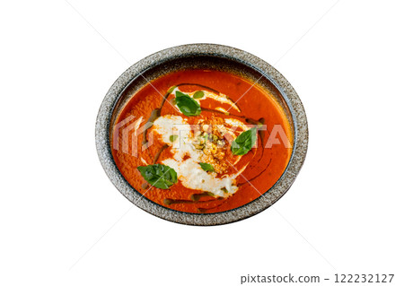 Plate of tomato gaspacho soup served with nuts isolated at white background. Plate of tomato gaspacho soup served with nuts isolated at white background. 122232127