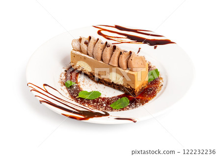 Plate with sweet layered cake dessert decorated with mint and chocolate cream as a children menu funny cheesecake isolated at white background. Plate with sweet layered cake dessert decorated with mint and chocolate cream as a children menu funny cheesecake isolated at white background. 122232236