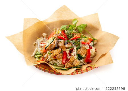 Closeup vietnamese healthy fresh salad of ckicken, bamboo, cabbage, cucumber and pepper served on paper at plate isolated at white background. Closeup vietnamese healthy fresh salad of ckicken, bamboo, cabbage, cucumber and pepper served on paper at plate isolated at white background. 122232396