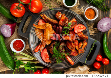Top view board of various meat set of fried chicken, sausages at decorated with vegetables wooden table background. 122232471