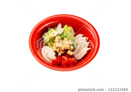 Red bowl of fresh caesar diet salad isolated at white background. Red bowl of fresh caesar diet salad isolated at white background. 122232484