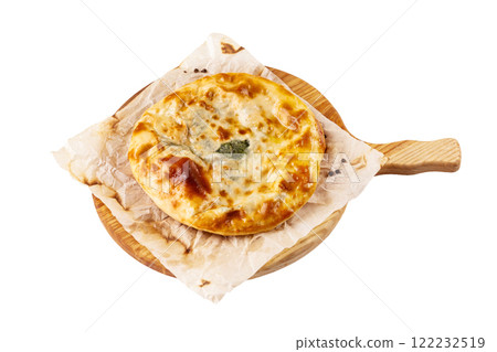 Yellow crispy adzharian khachapuri on a cooking paper on a wooden tray isolated at white background. Yellow crispy adzharian khachapuri on a cooking paper on a wooden tray isolated at white background. 122232519