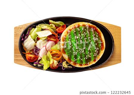 Pan of steamed asian rice with teriyaki sauce and fresh vegetables at wooden board isolated at white background. 122232645