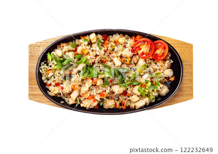 Top view pan of traditional Japanese rice with vegetables and chicken at wooden board isolated at white background. Top view pan of traditional Japanese rice with vegetables and chicken at wooden board isolated at white background. 122232649