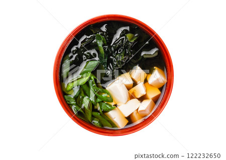 Closeup top view image of miso japanese soup with tofu and green onion isolated at white background. 122232650