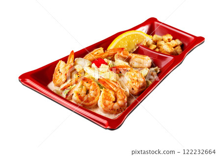Plate of asian salad with grilled prawns, chicken breast, lemon and croutons isolated at white background. 122232664