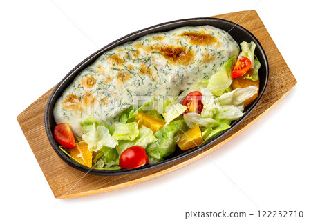 Pan with steamed fish fillet served with fresh vegetables at wooden board isolated at white background. Pan with steamed fish fillet served with fresh vegetables at wooden board isolated at white background. 122232710