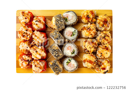 Top view set of hot sushi rolls with lava maki topping on wooden board isolated at white background. 122232756