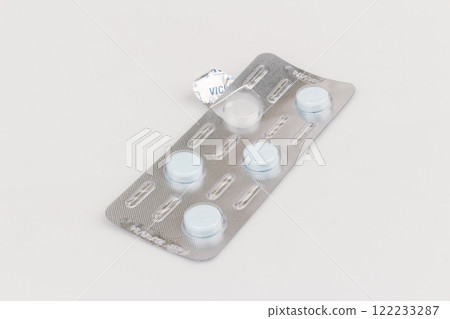 Used pill blister pack isolated on white background Used pill blister pack isolated on white background 122233287