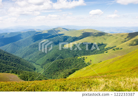 green mountain landscape with rolling hills. scenic natural scenery. beautiful view of borzhava ridge on a sunny day. travel to ukrainian highland in summer 122233387