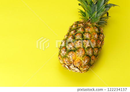 Pineapple on a yellow background Pineapple on a yellow background 122234137