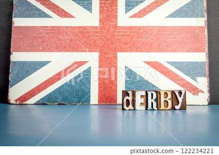 DERBY. Urban Area in Great Britain. Flag and alphabet letters on wooden texture background 122234221