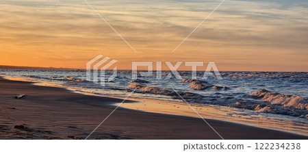 Beautiful sunset on the beach of the Gulf of Baltics. 122234238