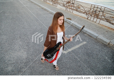 Girl Plays The Bass Instrument Music In The Street Girl Plays The Bass Instrument Music In The Street 122234590