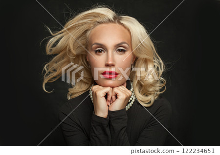 Blonde young female model fashion beauty portrait. Elegant woman with long blond curly hairstyle Blonde young female model fashion beauty portrait. Elegant woman with long blond curly hairstyle 122234651