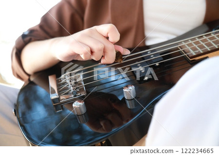 Hands Girl Plays The Bass Musical Instrument Among The Trees In The Park 122234665