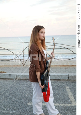Girl Plays The Bass Instrument Music In The Street Girl Plays The Bass Instrument Music In The Street 122234801