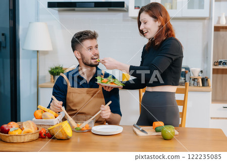 Couple Prepares Healthy Meals with Fresh Vegetables and Fruits. Couple Prepares Healthy Meals with Fresh Vegetables and Fruits. 122235085