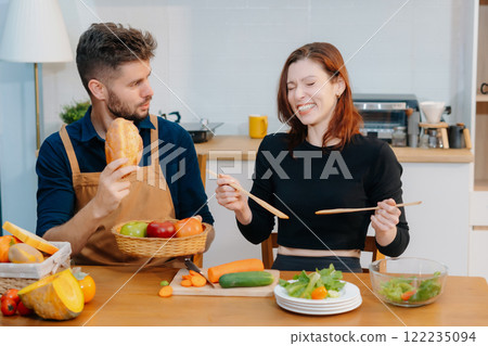 Couple Prepares Healthy Meals with Fresh Vegetables and Fruits. Couple Prepares Healthy Meals with Fresh Vegetables and Fruits. 122235094
