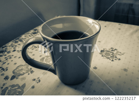 Red cup of coffee on grandmas table. Angra dos Reis. 122235217