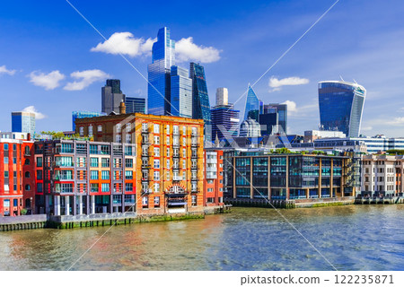 London, United Kingdom. Skyline view of the famous City, Thames River - England London, United Kingdom. Skyline view of the famous City, Thames River - England 122235871