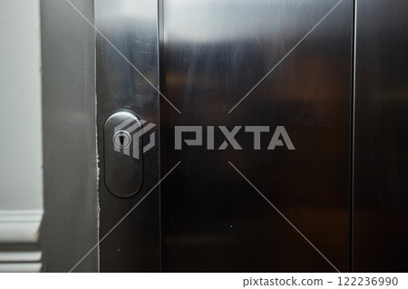 The modern elevator control panel features a display showcasing the current floor number The modern elevator control panel features a display showcasing the current floor number 122236990