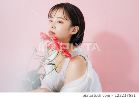 A young woman with flowers 122237651