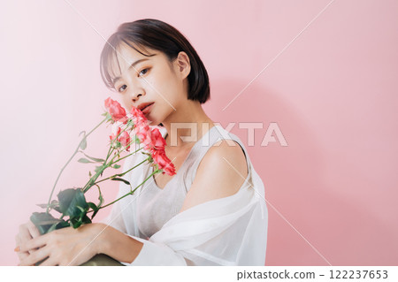 A young woman with flowers 122237653