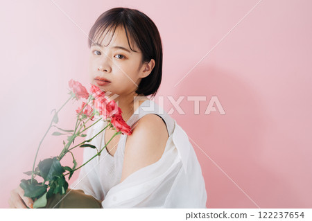 A young woman with flowers 122237654