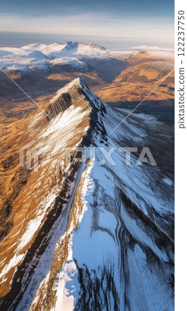 Majestic mountain range showcasing breathtaking peaks and valleys. Explore the stunning interplay of snow and earth. A visual feast for nature lovers. Generative AI 122237750