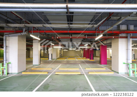 Underground car park in a residential building, a large number of designated spaces for cars 122238122