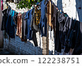 Drying laundry on a wire outside in the narrow streets of Tirana, Albania 122238751