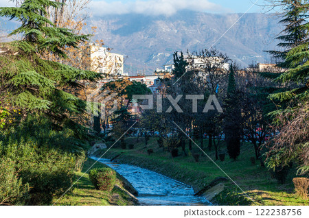 The Lana River with houses and mountains in the background, Tirana, Albania The Lana River with houses and mountains in the background, Tirana, Albania 122238756