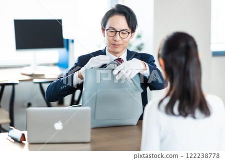 A buyer and a housewife assessing a bag A buyer and a housewife assessing a bag 122238778