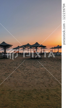 Sunrise painting the sky over empty beach in marsa alam, egypt Sunrise painting the sky over empty beach in marsa alam, egypt 122239794