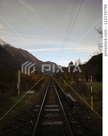 Train approaching on railway in chamonix valley, french alps 122239798