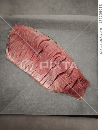 Fresh Sliced carp fillet prepared for christmas dinner baking on a tray 122239918