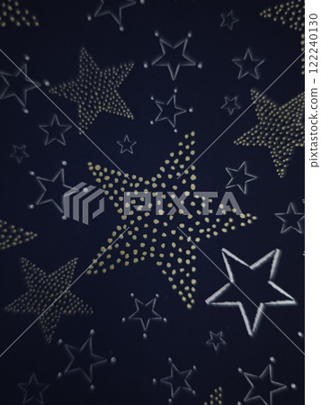Golden and silver stars shining on dark blue background for christmas Gift boxes New Year preparation decor 122240130