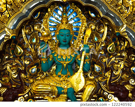 Indra statue Green giant, statues in Thai temples. Thai art in the temple. Calm and believe. 122240592