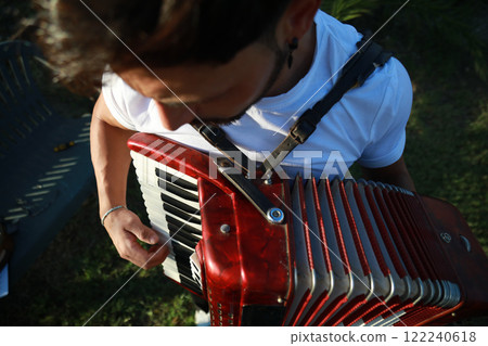 Hands On The Keyboard Of The Accordion 122240618