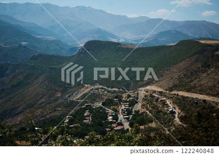 a view of the mountain road, city and mountains from the funicular near Tatev Monastery a view of the mountain road, city and mountains from the funicular near Tatev Monastery 122240848