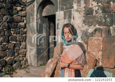 a young woman in scarf Sevanavank, monastery on lake Sevan, armenia a young woman in scarf Sevanavank, monastery on lake Sevan, armenia 122241055