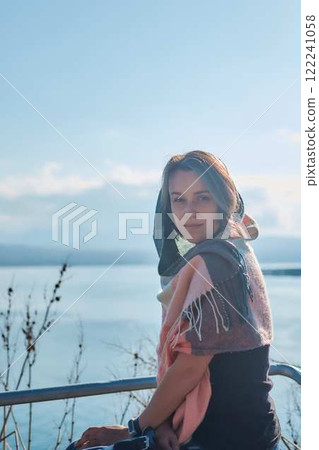 a young woman in scarf Sevanavank, monastery on lake Sevan, armenia a young woman in scarf Sevanavank, monastery on lake Sevan, armenia 122241058