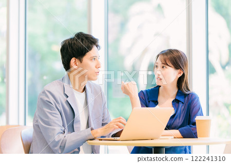 Young couple talking in a cafe 122241310